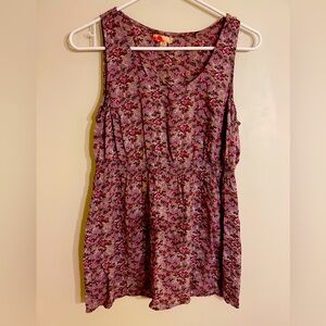 3/$15. Woman’s purple blouse with floral